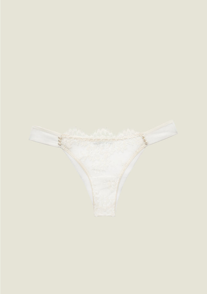 Pack shot of Feathers of a Swan Thong in cream color with pearl and lace trim detail