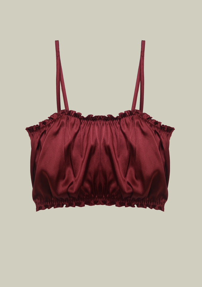 Lombard Street Ruffle Top flat lay front view showing rich wine colored fabric with elegant ruffle trim